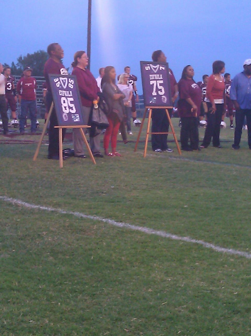 Selmon family members stand on the field at Eufaula during a ceremony retiring the numbers of Lee Roy, Dewey and Lucious Selmon on Friday, Sept. 28, 2012. PHOTO BY RYAN ABER, THE OKLAHOMAN