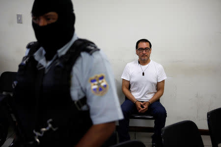 El Salvador's former attorney general Luis Martinez waits for a hearing, under charges of disclosure of reserved material of a case, in San Salvador, El Salvador October 16, 2018. REUTERS/Jose Cabezas/Files