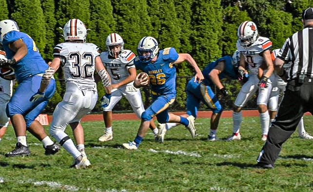 Ardsley High School's Tyler Siden running with ball during a football game. After three concussions by the end of his junior year, Tyler decided not to play football any longer.