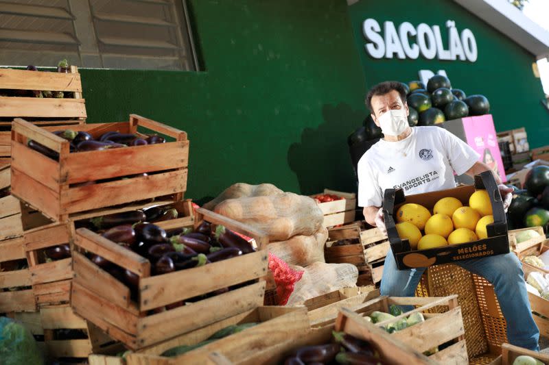 Former Brazil's head soccer coach Dunga helps with food distribution to poor people, amid the coronavirus disease (COVID-19) outbreak, in Porto Alegre