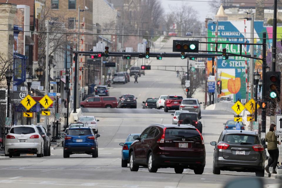 FILE - Downtown Manitowoc along Eighth Street in April 29, 2022, before the conversion to two-way.