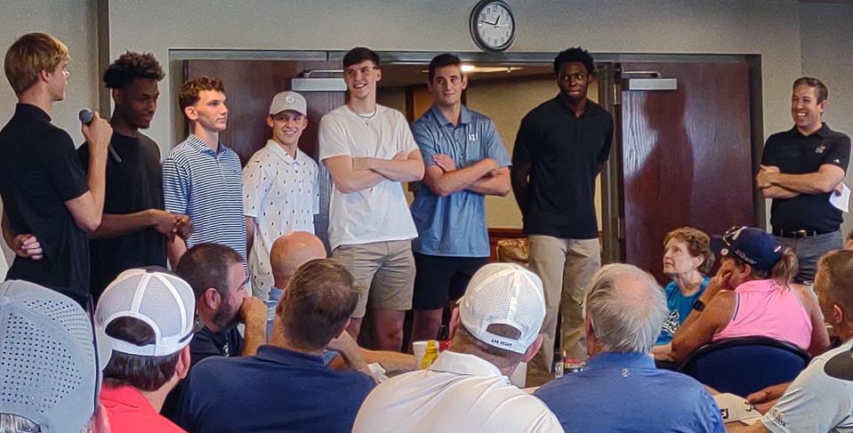 Gradey Dick (left) holds a microphone as he speaks to a crowd earlier this year at the Dale Willey Memorial Golf Tournament. Dick was joined at the event by teammates MJ Rice, Wilder Evers, Charlie McCarthy, Zach Clemence, Dillon Wilhite and Ernest Udeh Jr.