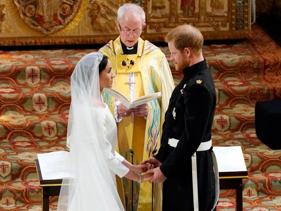 Prince Harry and Meghan Markle exchange vows during their wedding ceremony in St George's Chapel at Windsor Castle on May 19, 2018 in Windsor, England