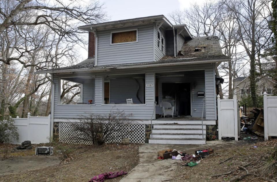 Damage is seen on a house where a fatal fire occurred overnight in Baltimore, Friday, March 3, 2017, where officials say two people died and four people were critically injured. (AP Photo/Patrick Semansky)