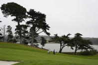 Davis Love III, right, walks on the 15th fairway during practice for the PGA Championship golf tournament at TPC Harding Park in San Francisco, Tuesday, Aug. 4, 2020. (AP Photo/Jeff Chiu)