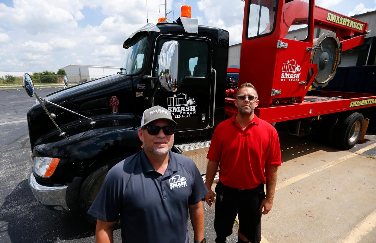 Smash My Trash General Manager Mike Turner and Driver Tom Back.