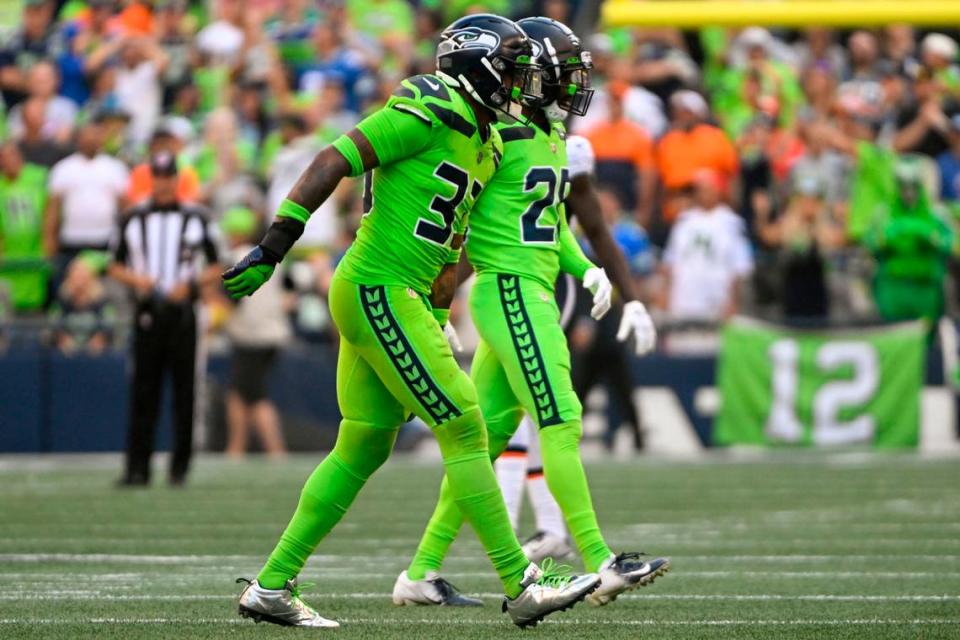 Seattle Seahawks safety Jamal Adams (33) limps off the field after attempting to tackle Denver Broncos quarterback Russell Wilson (3) during the second quarter of an NFL game on Monday, Sept. 12, 2022, at Lumen Field in Seattle. Pete Caster/Pete Caster / The News Tribune