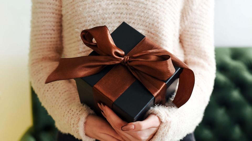 gift box in female hands new year christmas gift