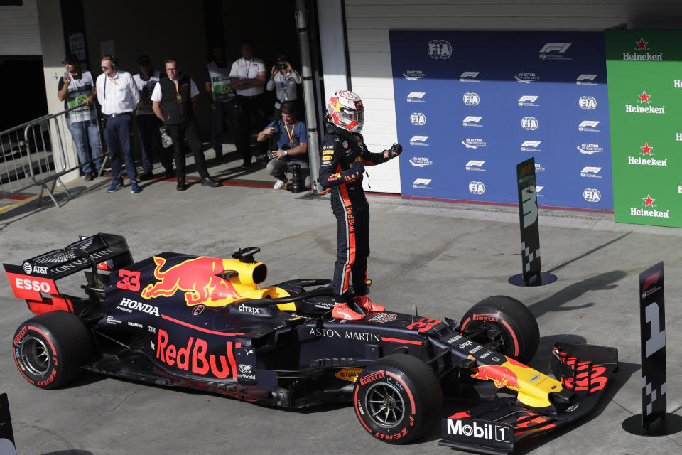 Red Bull driver Max Verstappen, of the Netherlands, celebrates after taking pole position during the qualifying session for the Formula One Brazil Grand Prix at the Interlagos race track in Sao Paulo, Brazil, Saturday, Nov. 16, 2019. (AP Photo/Silvia Izquierdo)