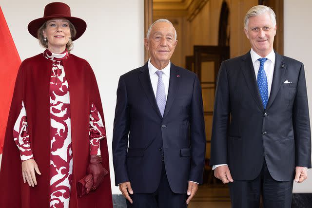<p>BENOIT DOPPAGNE/Belga/AFP via Getty Images</p> Queen Mathilde of Belgium, President of Portugal Marcelo Rebelo de Sousa and King Philippe at the Royal Palace on October 17
