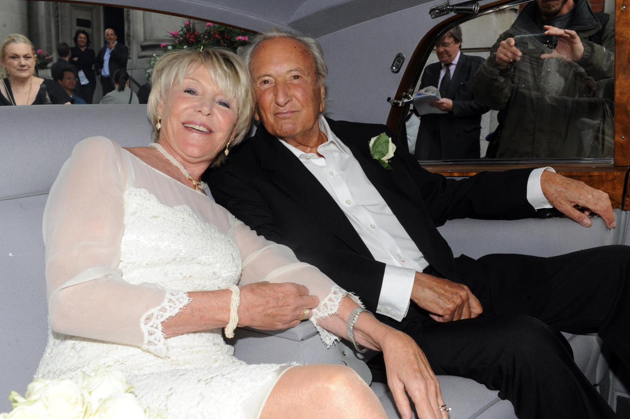 Michael Winner and wife Geraldine leave Chelsea Registry Office, London, following their wedding.   (Photo by Anthony Devlin/PA Images via Getty Images)