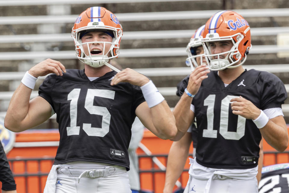 Florida quarterback Graham Mertz, left, calls play as quarterback Jack Miller III looks on during NCAA college football practice at Ben Hill Griffin Stadium in Gainesville, Fla., Saturday, Aug. 5, 2023. (Willie J. Allen Jr./Orlando Sentinel via AP)