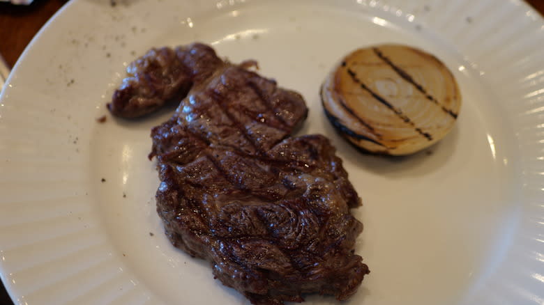 Well done steak with onion