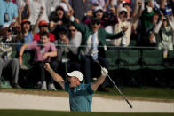 Rory McIlroy, of Northern Ireland, reacts after holing out from the bunker for a birdie during the final round at the Masters golf tournament on Sunday, April 10, 2022, in Augusta, Ga. (AP Photo/Matt Slocum)