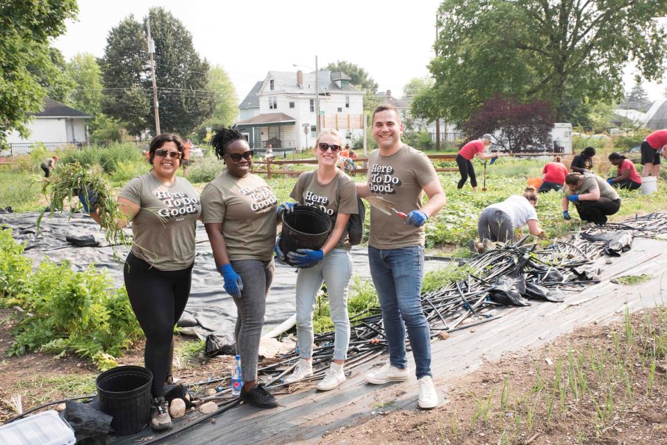 Besa CEO Matthew Goldstein, far right, gardens at Franklinton Farms with staff and other volunteers in July 2021.