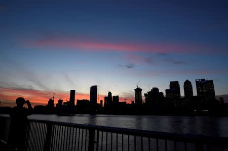 FILE PHOTO: The Canary Wharf financial district is seen at dusk in London, Britain, November 17, 2017. REUTERS/Toby Melville/File Photo