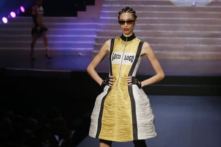 A model presents a creation by French designer Jean Paul Gaultier as part of his Spring/Summer 2015 women's ready-to-wear collection during Paris Fashion Week September 27, 2014. REUTERS/Gonzalo Fuentes