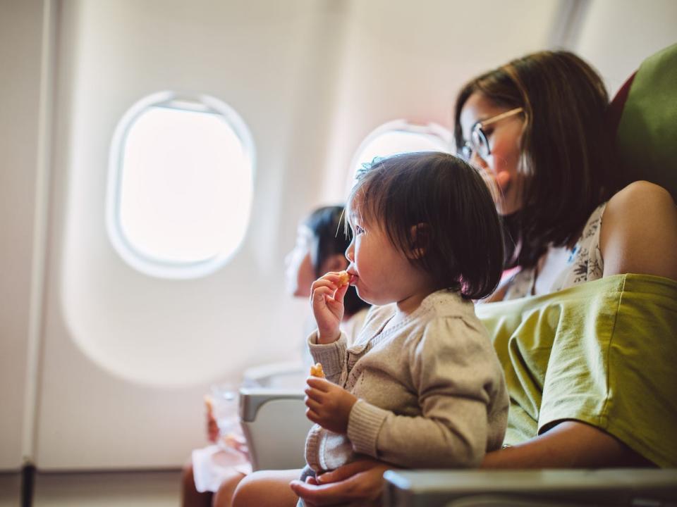 A family sits on an airplane.