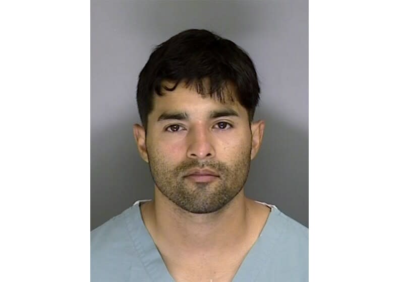 FILE - This Sunday, June 7, 2020, booking photo from the Santa Cruz County Sheriff's Office shows 32-year-old suspect Steven Carrillo. The Air Force sergeant already jailed in the ambush killing of a California sheriff's deputy was charged Tuesday, June 16, 2020 in the shooting death of a federal security officer outside the U.S. courthouse in Oakland during a night of violent protest last month. Staff Sgt. Steven Carrillo was charged with murder and attempted murder in the killing of federal officer Dave Patrick Underwood, 53. He died from gunshot wounds and another federal officer was critically injured in the drive-by shooting outside the Ronald V. Dellums Federal Building on May 29. (Santa Cruz Sheriff's Office via AP, File)