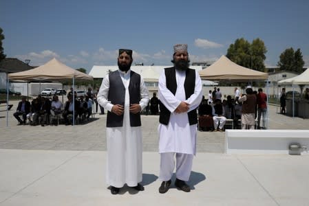 Muslims stand outside the first official mosque in Athens