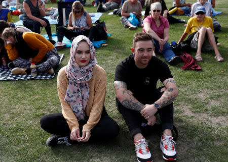 People attend a vigil for victims of the mosque shootings in Christchurch, New Zealand March 24, 2019. REUTERS/Edgar Su