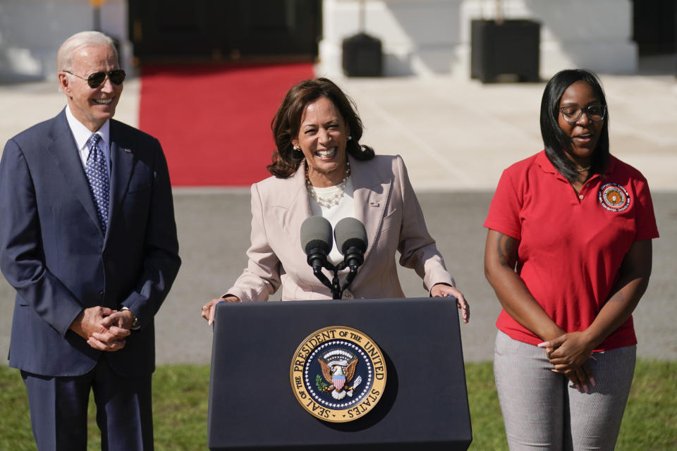 President Joe Biden listens as Vice President Kamala Harris speaks during a ceremony about the Inflation Reduction Act of 2022, on the South Lawn of the White House in Washington, Tuesday, Sept. 13, 2022. Lovette Jacobs, a fifth-year IBEW Local 103 electrical apprentice in Boston, stands at right. (AP Photo/Andrew Harnik)