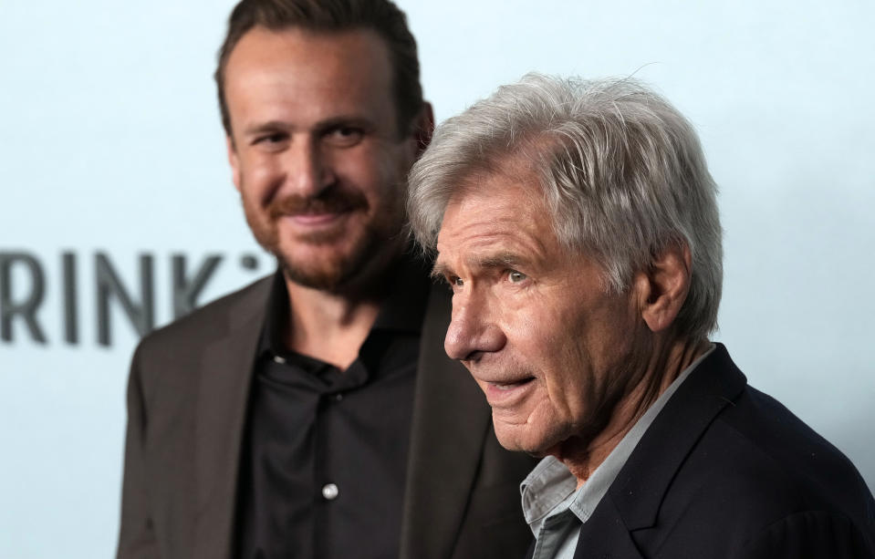 Harrison Ford, right, a cast member in "Shrinking," poses as the show's creator/co-writer/executive producer/cast member, Jason Segel, looks on at the premiere of the Apple TV+ series, Thursday, Jan. 26, 2023, at the Directors Guild of America in Los Angeles. (AP Photo/Chris Pizzello)