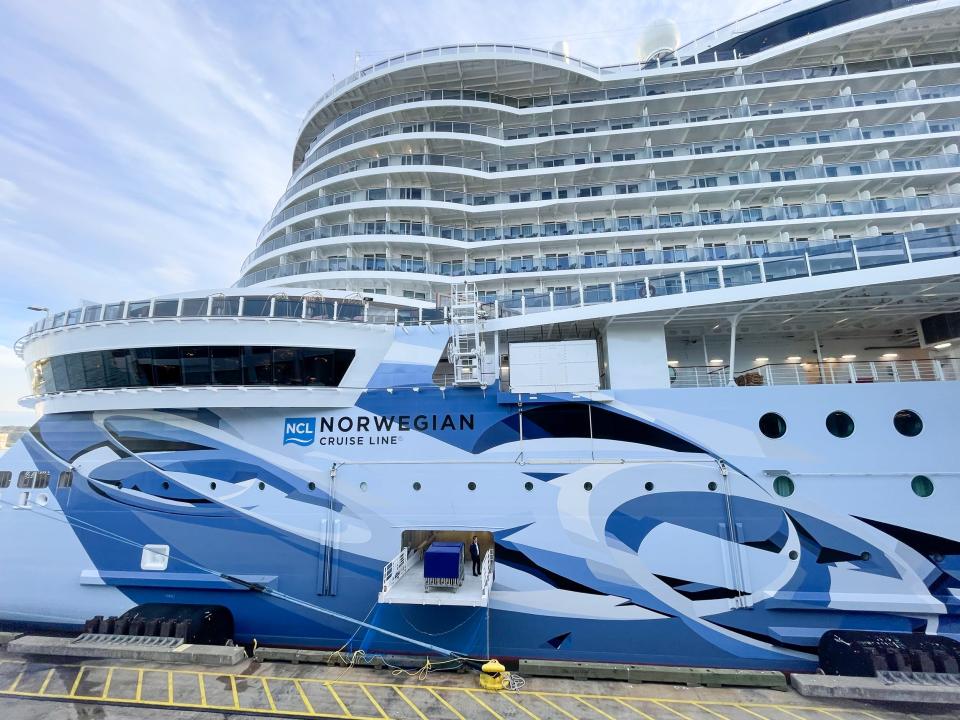 A Norwegian Cruise Line cruise ship at a port.