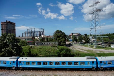 Cuba's Chinese-made first new train passenger cars move after departing from La Coubre train station in Havana