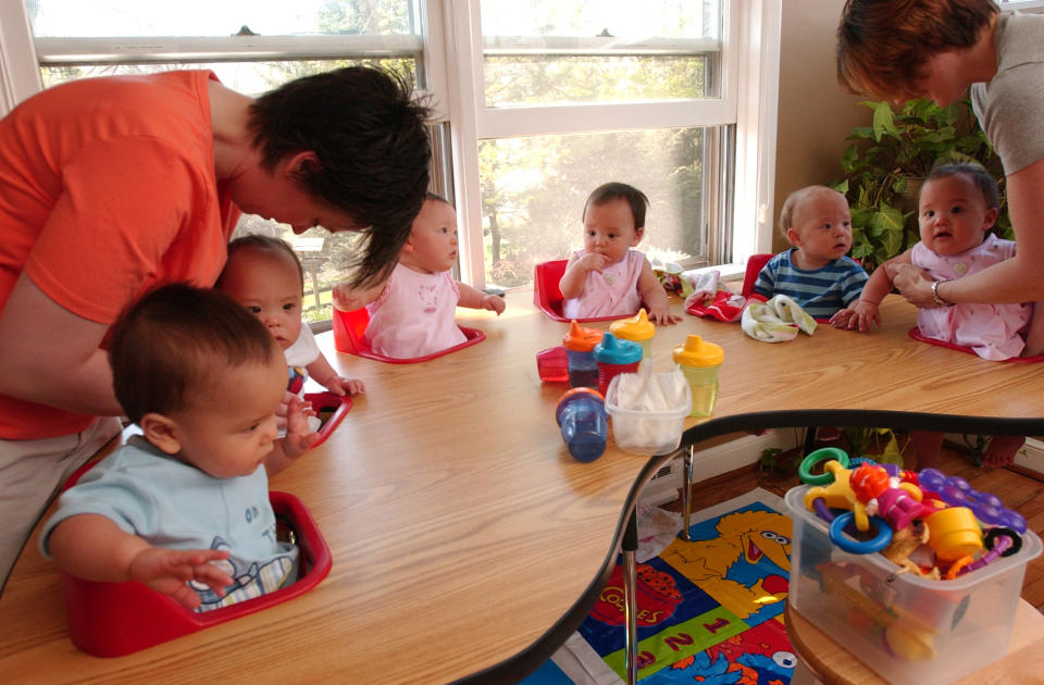 Nurse Angie Crawl and Kate Gosselin get Kate's kids (from  left) Collin, Joel, Alexis, Leah, Aaden, and Hannah, ready for lunch