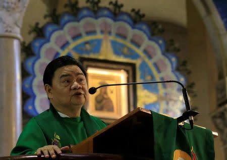 Rev. F. Carlos Ronquillo, a Rector Superior of the National Shrine of Our Mother of Perpetual Help gestures as he talks about a pastoral letter from the Catholic Bishops' Conference of the Philippines (CBCP) about the drug war of President Rodrigo Duterte during a mass at Redemptorist church in Paranaque city, metro Manila, Philippines February 5, 2017. REUTERS/Romeo Ranoco