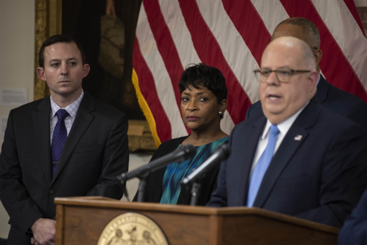 Larry Hogan, right, with Bill Ferguson and Adrienne Jones