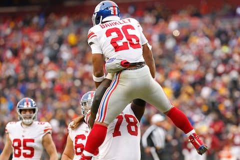 New York Giants running back Saquon Barkley (26) celebrates with New York Giants offensive guard Jamon Brown (78) after scoring a touchdown in the second quarter at FedEx Field - Credit: Geoff Burke/USA TODAY