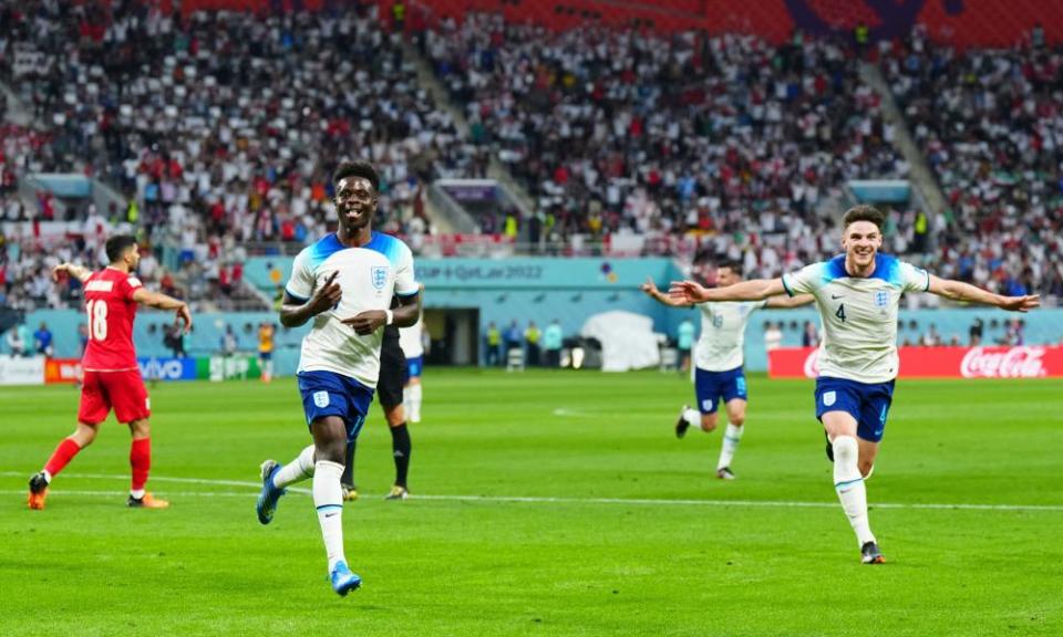 Bukayo Saka celebrates one of his two goals against Iran