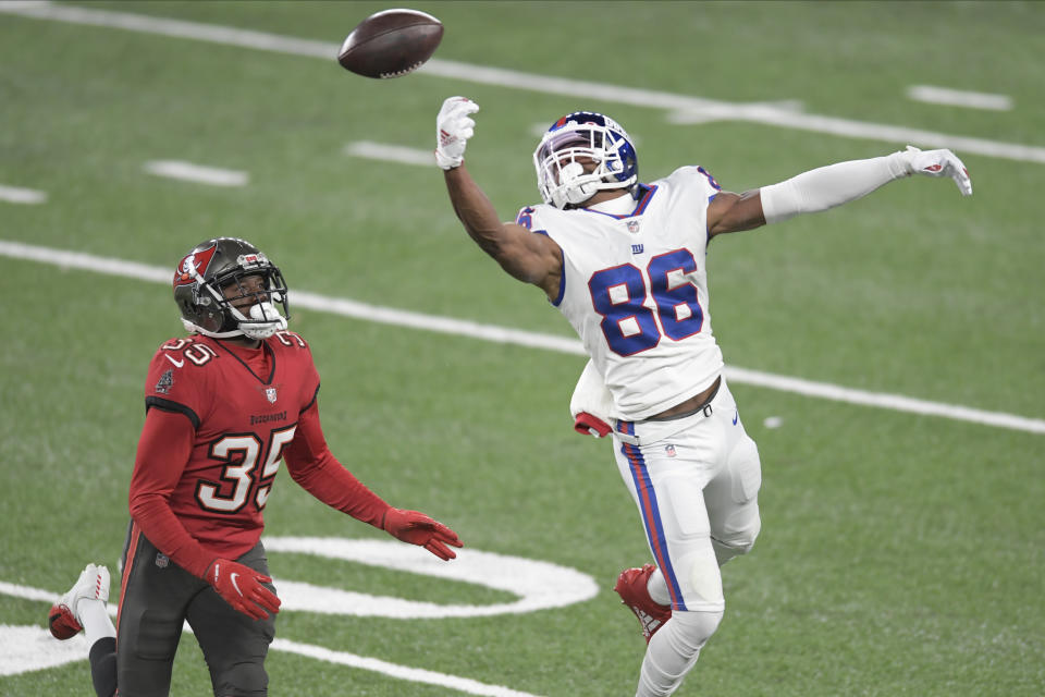 New York Giants' Darius Slayton, right, cannot make the catch in front of Tampa Bay Buccaneers' Jamel Dean during the second half of an NFL football game, Monday, Nov. 2, 2020, in East Rutherford, N.J. (AP Photo/Bill Kostroun)