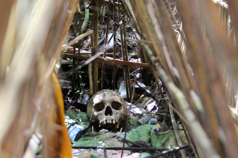 Pictured is a skull in an open grave in Trunyan in Bali.