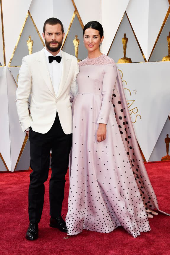 HOLLYWOOD, CA - FEBRUARY 26: Actors Jamie Dornan (L) and Amelia Warner attend the 89th Annual Academy Awards at Hollywood & Highland Center on February 26, 2017 in Hollywood, California. (Photo by Frazer Harrison/Getty Images)