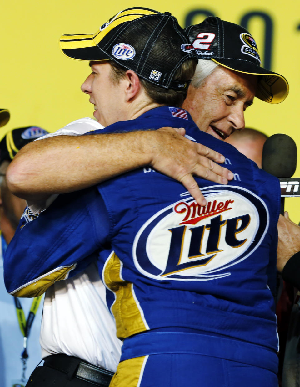 FILE - Brad Keselowski hugs owner Roger Penske after winning the NASCAR Sprint Cup Series championship following an auto race at Homestead-Miami Speedway, Sunday, Nov. 18, 2012, in Homestead, Fla. Heading into the race Sunday, Oct. 31, 2021, at Martinsville Speedway, Keselowski is in the final two races of his NASCAR career with Team Penske and would love nothing more than to close his 12-year run with another Cup championship. (AP Photo/Terry Renna, File)