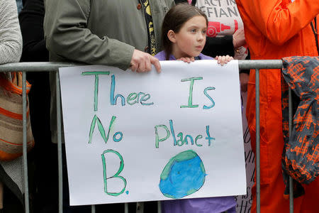 Protesters line Central Park West during the Earth Day 'March For Science NYC' demonstration to coincide with similar marches globally in Manhattan, New York, U.S., April 22, 2017. REUTERS/Andrew Kelly