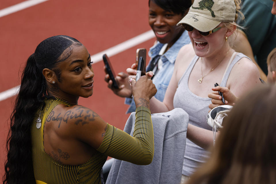 Sha'Carri Richardson talks with reporters after winning the women's 100 meters at the Prefontaine Classic track and field meet Saturday, May 25, 2024, in Eugene, Ore. (AP Photo/Thomas Boyd)