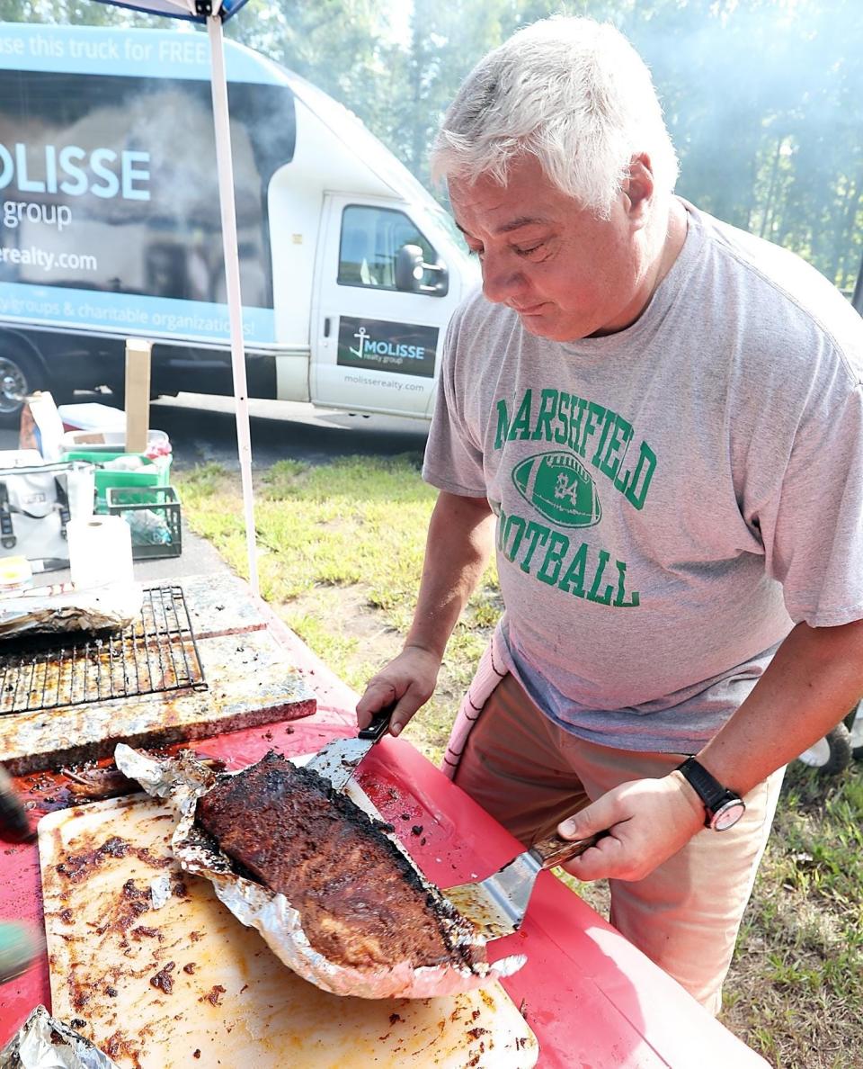 Steve Contos, of Marshfield, participates in the 2019 North Community Church Rib Cook-Off.