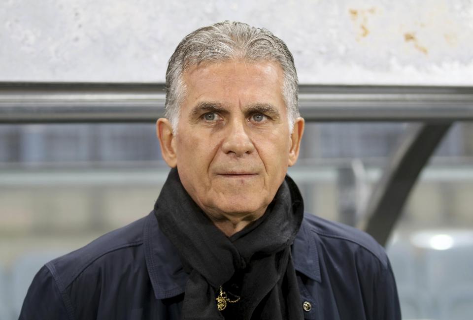 Iran’s coach Carlos Queiroz stands by the bench prior to a friendly soccer match between Iran and Panama in Graz, Austria. (AP Photo/Ronald Zak, File)