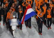 Flag-bearer Jorien ter Mors of the Netherlands leads her country's contingent during the opening ceremony of the 2014 Sochi Winter Olympics, February 7, 2014. REUTERS/Lucy Nicholson