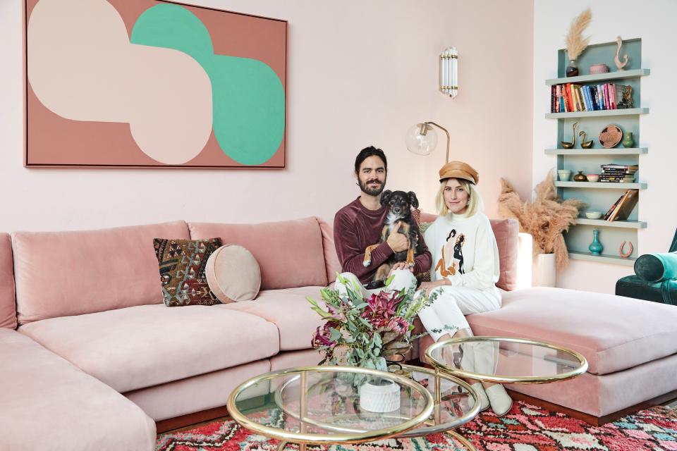 The Dazey LA family includes Phillip, Dani, and their dog, Franklin, who is named after the neighborhood (Franklin Village) where the couple met. Here, they sit on Dani’s favorite piece in the home. “It's hard to deny the epic-ness of the pink velvet couch.”