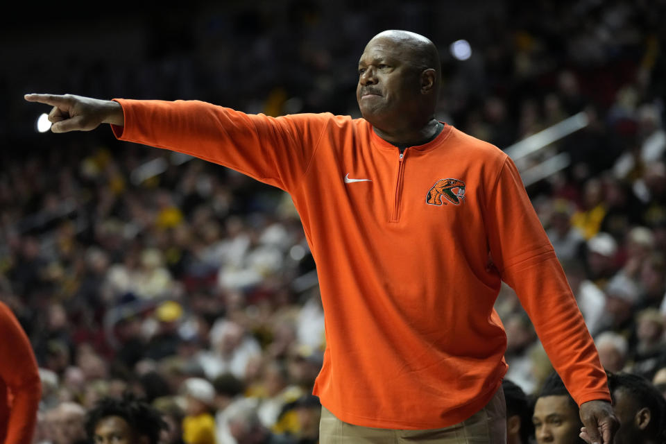 Florida A&M head coach Robert McCullum directs his team during the first half of an NCAA college basketball game against Iowa, Saturday, Dec. 16, 2023, in Des Moines, Iowa. (AP Photo/Charlie Neibergall)