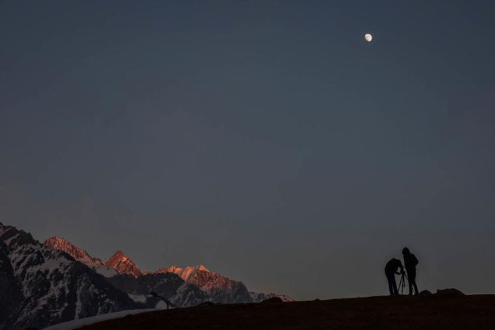 Photographers set their tripod to take pictures during a cold winter evening in Sonamarg, about 100kms northeast of Srinagar, the summer capital of Jammu and Kashmir.