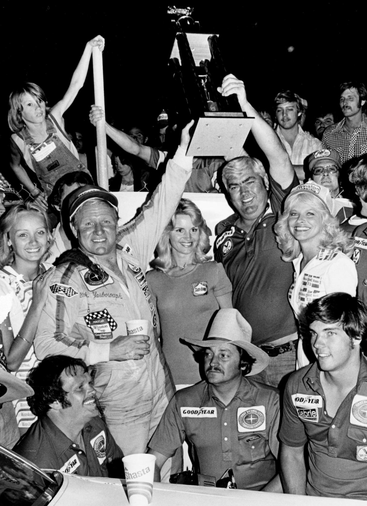 Driver Cale Yarborough, second from left, and car owner Junior Johnson, second from right, celebrates their victory in the Music City 420 before a near-record crowd of 21,500 at Nashville Speedway June 3, 1978. Yarborough became the only third diver in NASCAR Grand National history to lead a race from start to finish when he led every lap of the race.