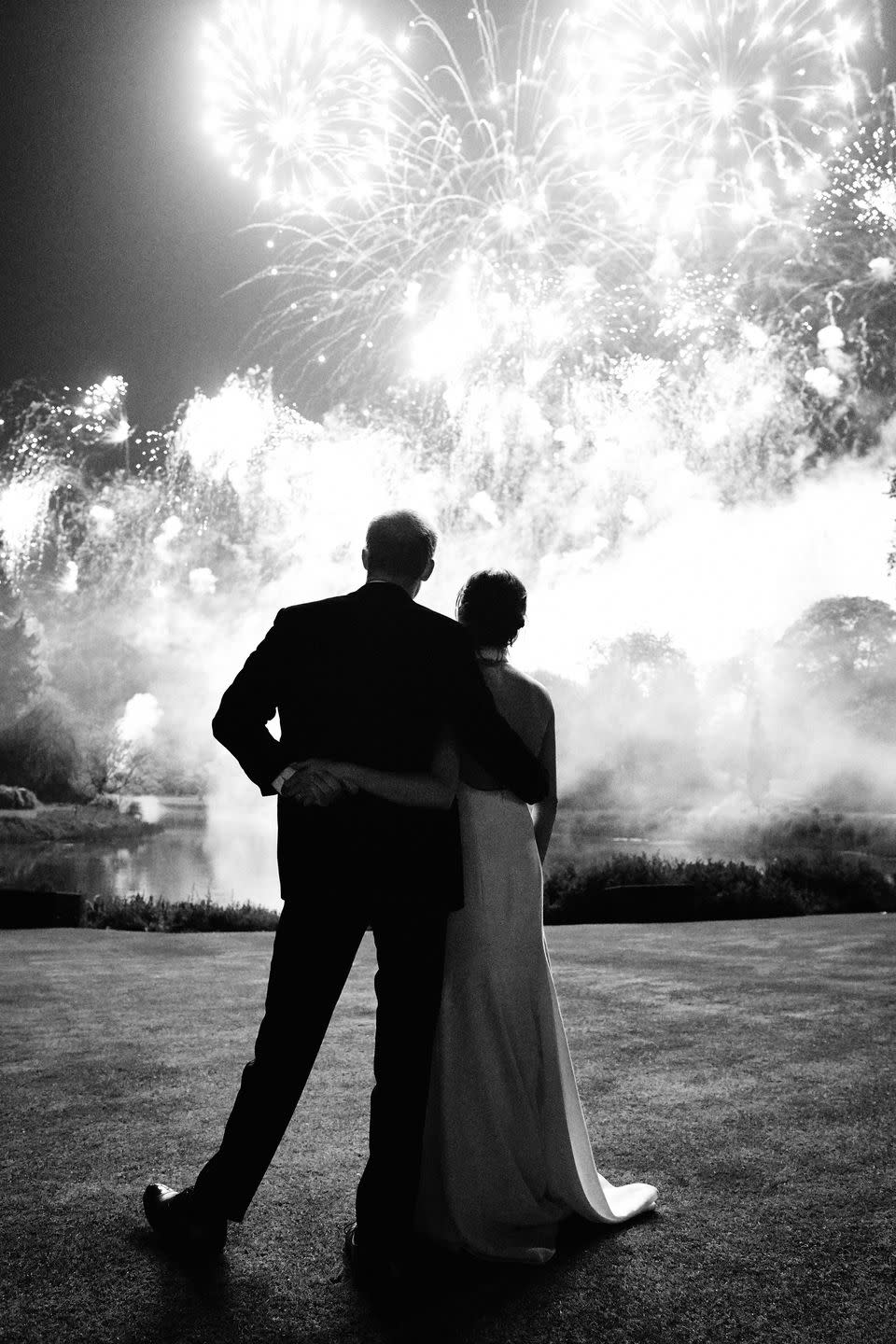 <p>The Duke and Duchess of Sussex capped off an exciting year by sharing <a href="https://www.townandcountrymag.com/society/tradition/a25584157/prince-harry-meghan-markle-frogmore-house-christmas-card-2018/" rel="nofollow noopener" target="_blank" data-ylk="slk:an intimate black and white photograph from their wedding celebration as their 2018 Christmas Card;elm:context_link;itc:0;sec:content-canvas" class="link ">an intimate black and white photograph from their wedding celebration as their 2018 Christmas Card</a>. The heart-warming shot features the couple embracing at their wedding reception at Frogmore House while watching fireworks— and features Meghan's now iconic white Stella McCartney wedding dress. </p>