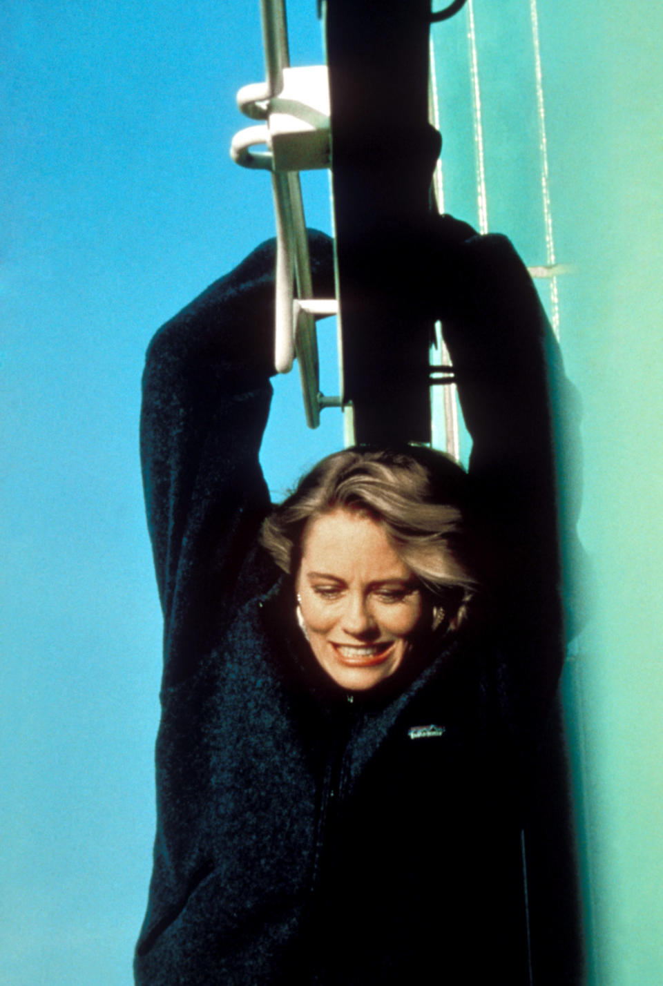 MOONLIGHTING First Episode: Cybill Shepherd dangles from the clock hand of the Eastern Columbia Building