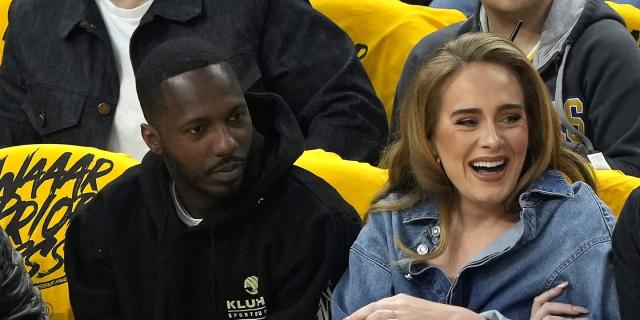 Adele wears Louis Vuitton at an NBA game with boyfriend Rich Paul